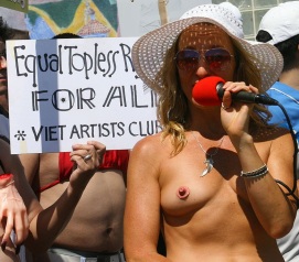 Woman protesting with nipple-shaped pasties.